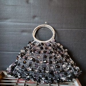 Black metal stone mesh bag. Made in Brazil